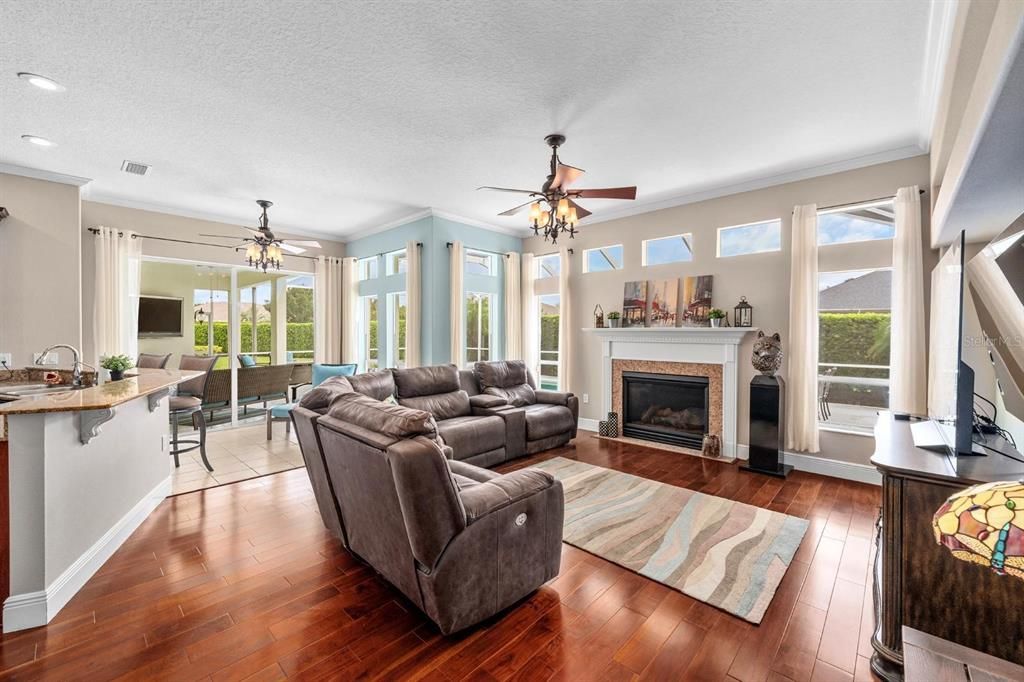 Dining room, Fireplace, Interior, Living room, Recessed Lighting, Wood Texture Flooring