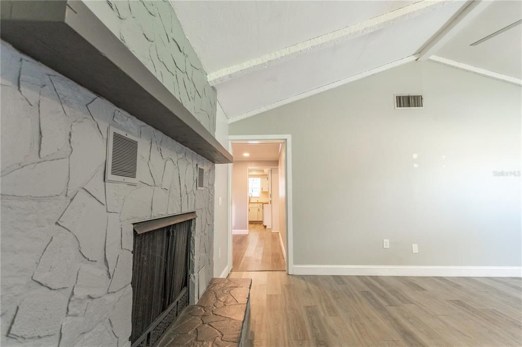 Fireplace, Interior, Marble Walls, Recessed Lighting, Wood Texture Flooring