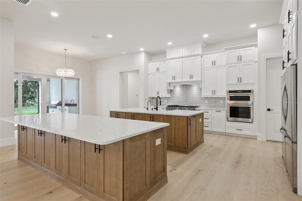 Chandelier, Interior, Kitchen, Recessed Lighting, Stainless Steel Appliances, Wood Texture Flooring