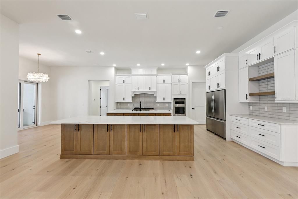 Chandelier, Interior, Kitchen, Recessed Lighting, Stainless Steel Appliances, Wood Texture Flooring