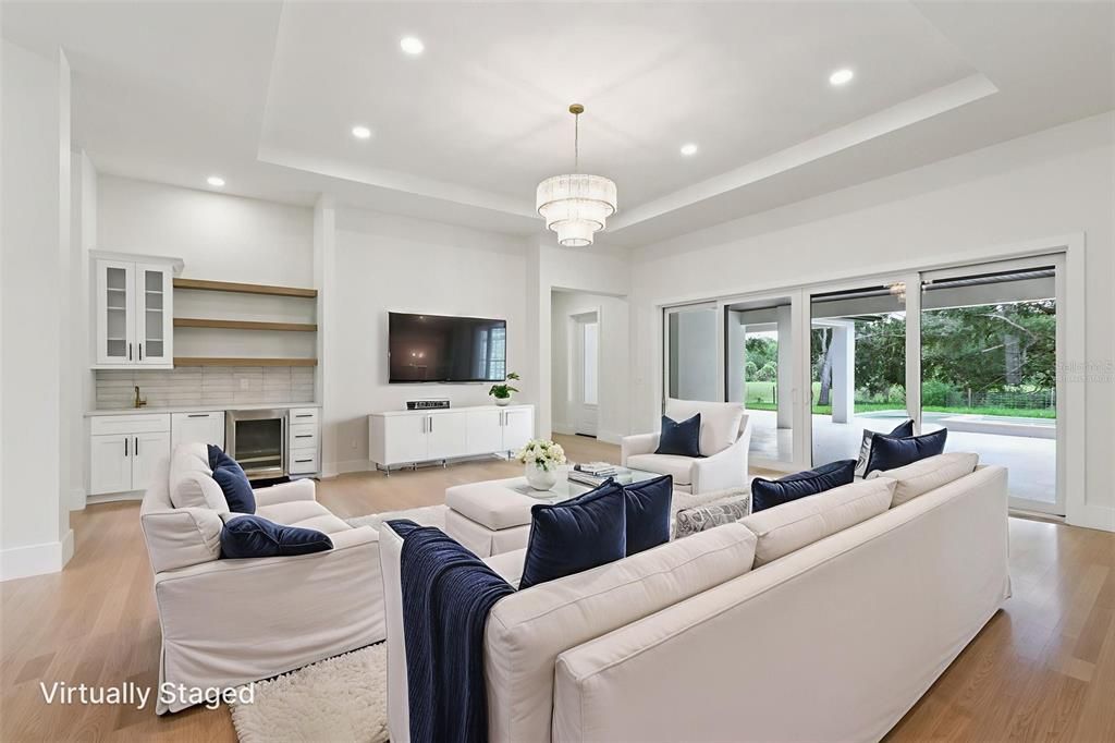 Chandelier, Fireplace, Interior, Living room, Recessed Lighting, Wood Texture Flooring