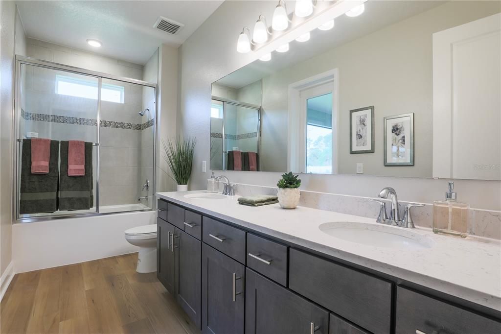 Bathroom, Dual Sink Vanities, Glass Shower, Interior, Recessed Lighting, Wood Texture Flooring