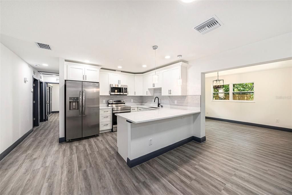 Interior, Kitchen, Pendant Lights, Recessed Lighting, Stainless Steel Appliances, Wood Texture Flooring