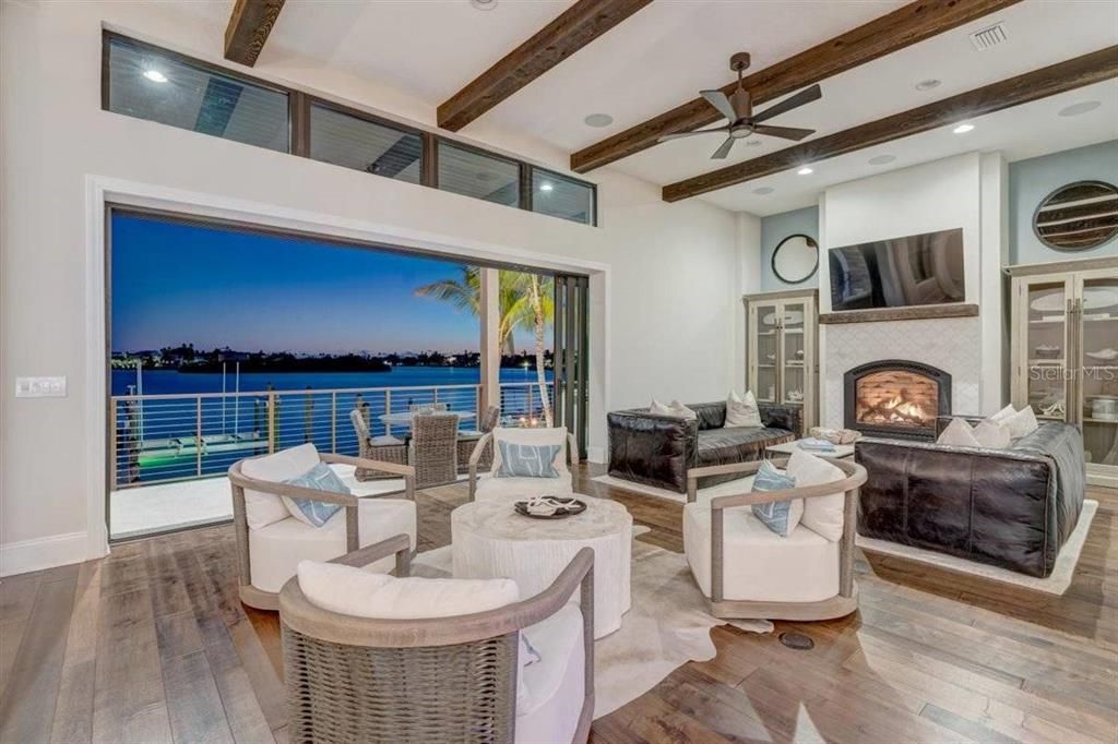 Fireplace, Interior, Living room, Recessed Lighting, Water, Wooden Beams, Wood Texture Flooring