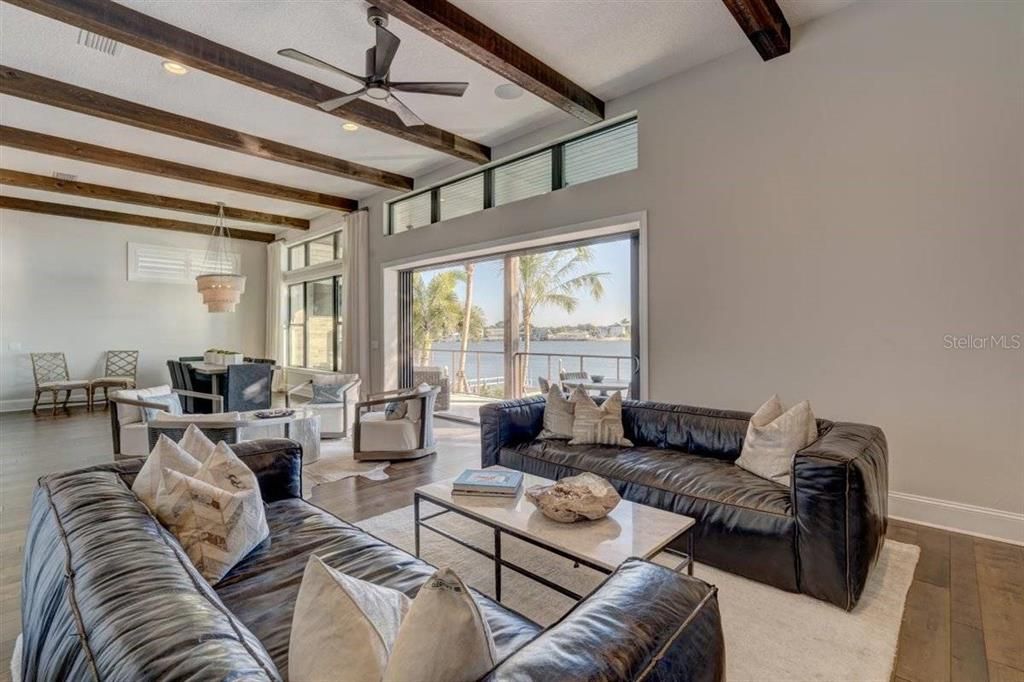 Dining room, Interior, Living room, Pendant Lights, Recessed Lighting, Water, Wooden Beams, Wood Texture Flooring