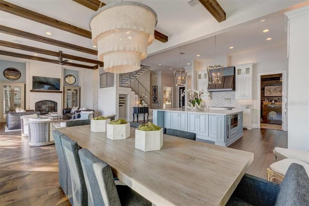 Chandelier, Dining room, Fireplace, Interior, Kitchen, Living room, Pendant Lights, Recessed Lighting, Wooden Beams, Wood Texture Flooring