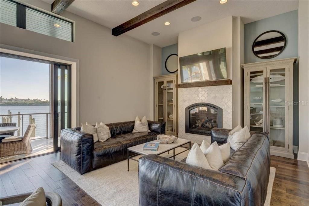 Fireplace, Interior, Living room, Recessed Lighting, Water, Wooden Beams, Wood Texture Flooring