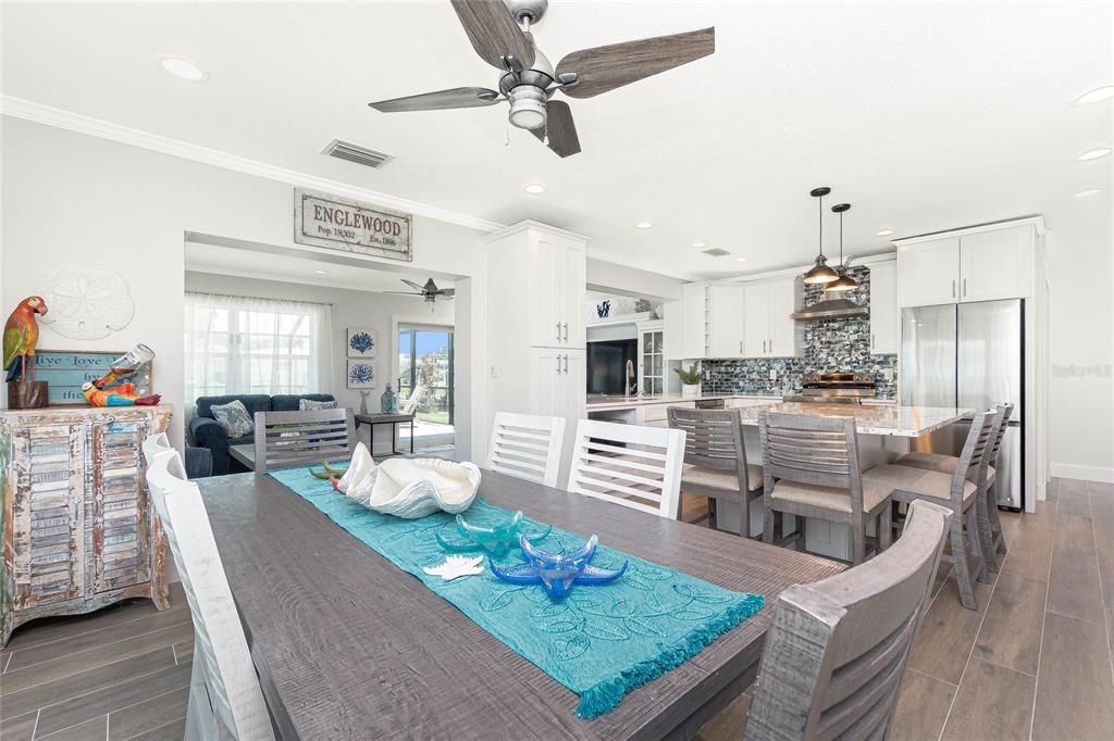 Dining room, Interior, Kitchen, Living room, Pendant Lights, Recessed Lighting, Stainless Steel Appliances, Wood Texture Flooring