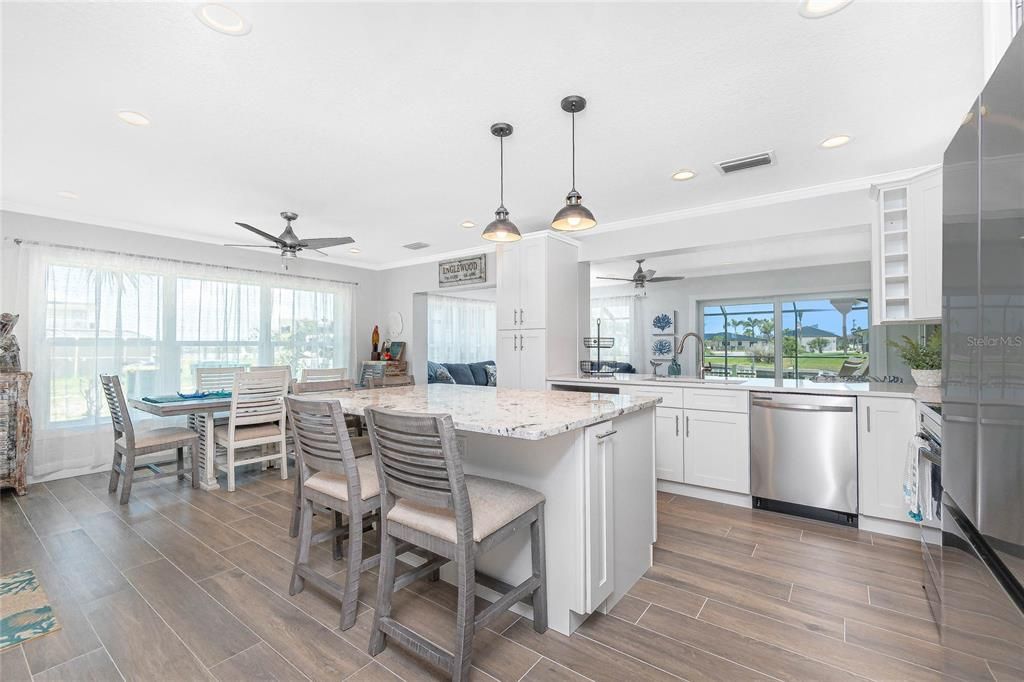 Dining room, Interior, Kitchen, Pendant Lights, Recessed Lighting, Stainless Steel Appliances, Wood Texture Flooring