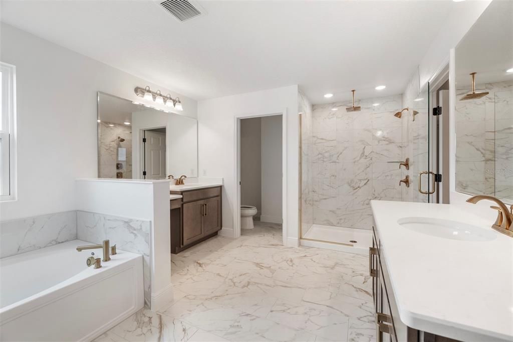 Bathroom, Dual Sink Vanities, Glass Shower, Interior, Marble, Marble Walls, Recessed Lighting