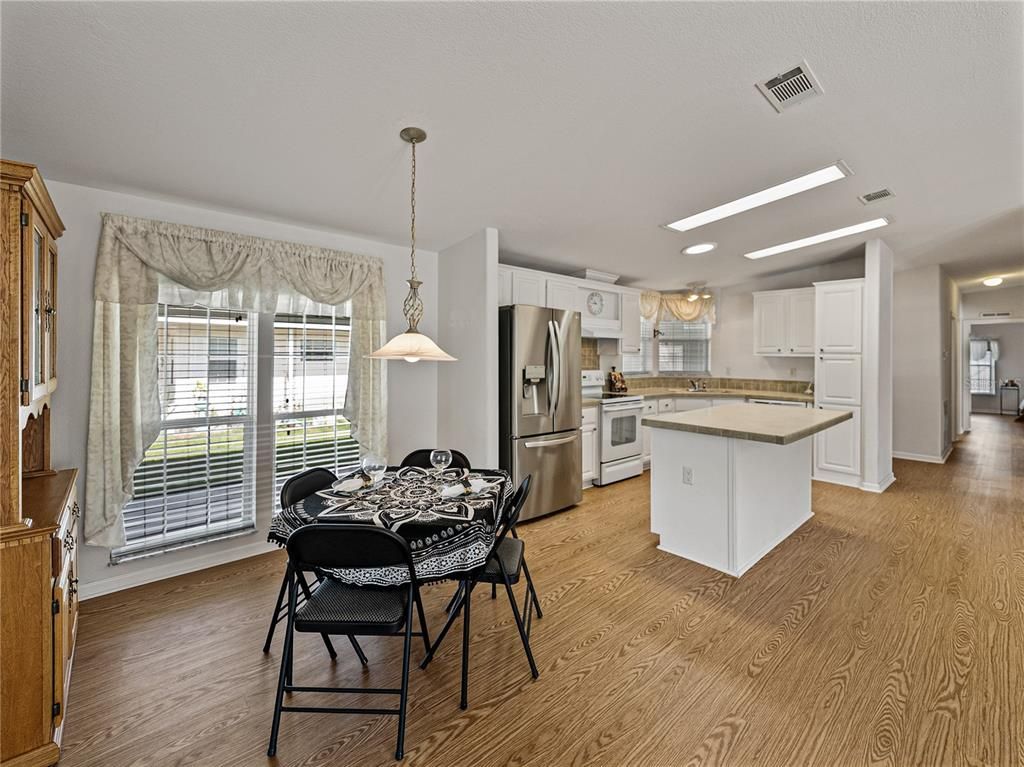 Dining room, Interior, Kitchen, Pendant Lights, Recessed Lighting, Stainless Steel Appliances, Wood Texture Flooring