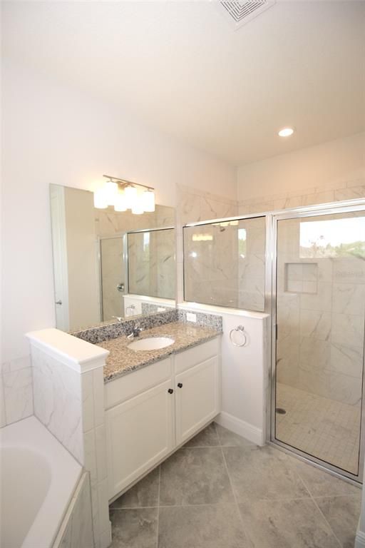 Bathroom, Dual Sink Vanities, Glass Shower, Interior, Marble Walls, Recessed Lighting