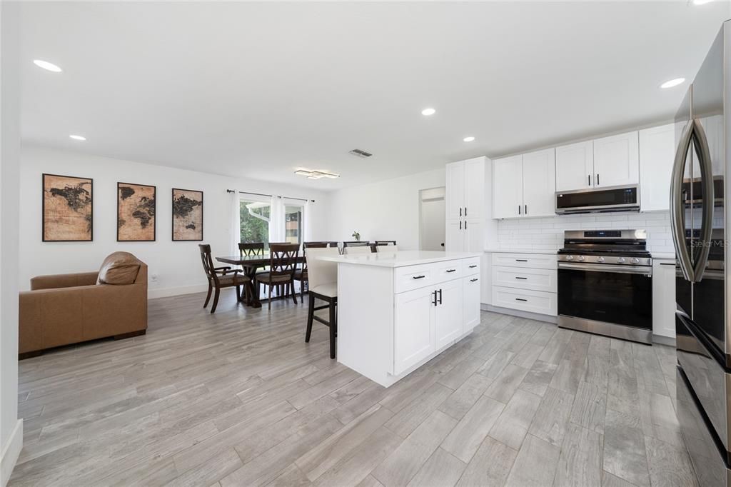 Dining room, Interior, Kitchen, Recessed Lighting, Stainless Steel Appliances, Wood Texture Flooring