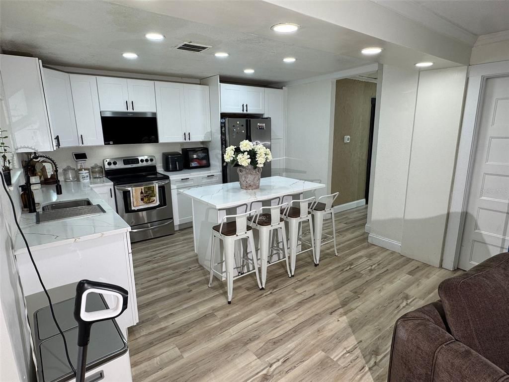 Interior, Kitchen, Recessed Lighting, Stainless Steel Appliances, Wood Texture Flooring