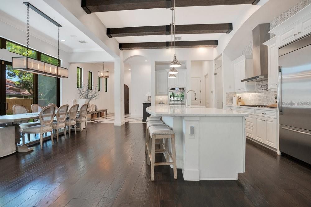 Dining room, Interior, Kitchen, Pendant Lights, Recessed Lighting, Stainless Steel Appliances, Wooden Beams, Wood Texture Flooring