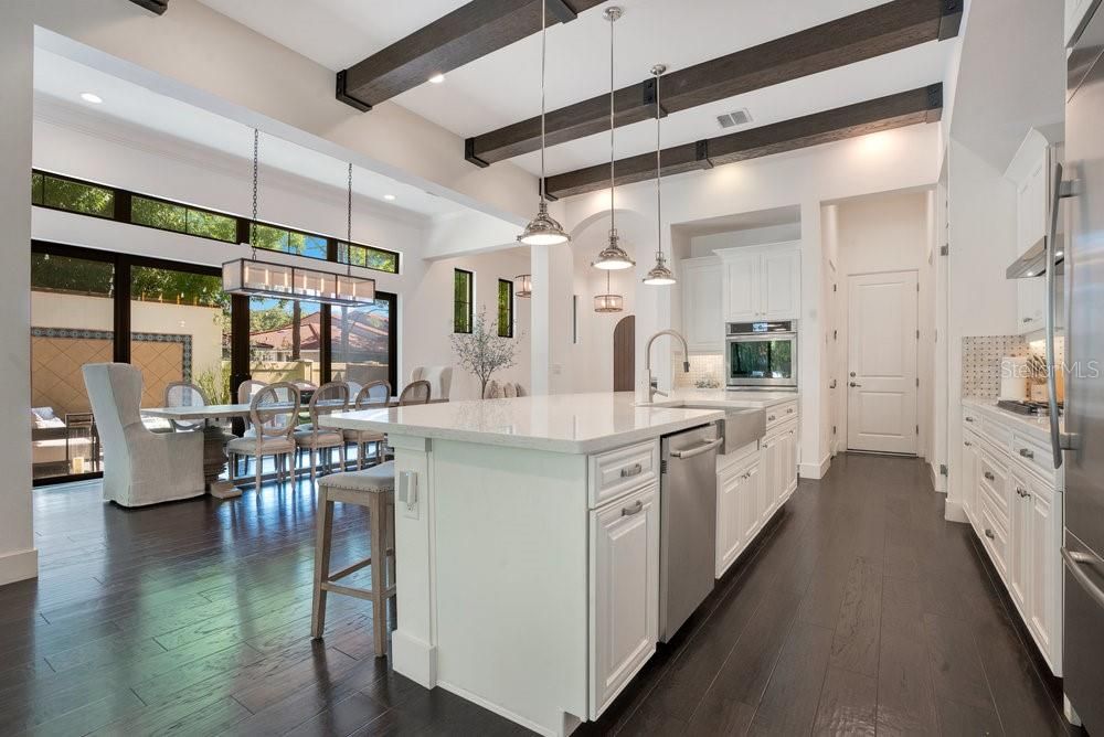 Dining room, Interior, Kitchen, Pendant Lights, Recessed Lighting, Stainless Steel Appliances, Wooden Beams, Wood Texture Flooring