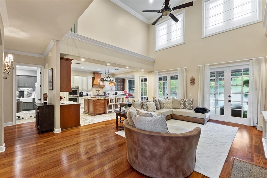 Chandelier, Interior, Kitchen, Living room, Pendant Lights, Recessed Lighting, Stainless Steel Appliances, Wood Texture Flooring