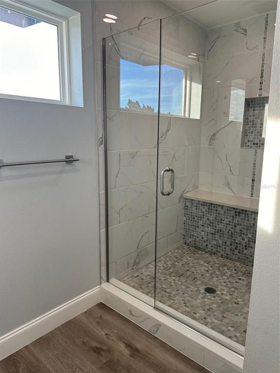 Bathroom, Glass Shower, Interior, Marble Walls, Recessed Lighting, Wood Texture Flooring