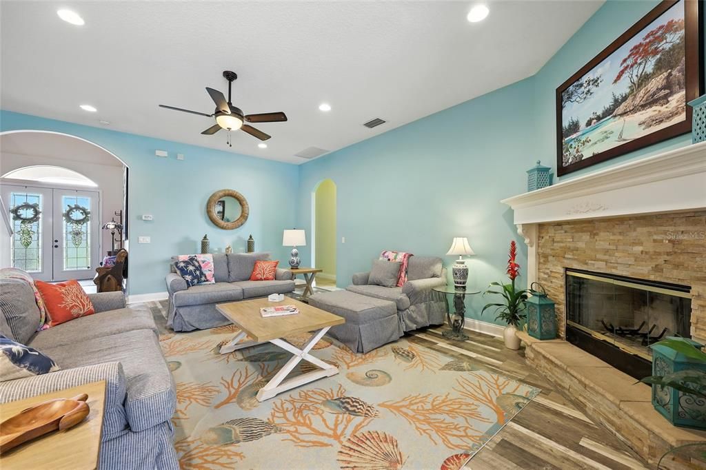 Fireplace, Interior, Living room, Recessed Lighting, Stone Walls, Wood Texture Flooring