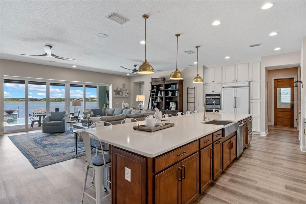 Dining room, Interior, Kitchen, Living room, Pendant Lights, Recessed Lighting, Stainless Steel Appliances, Water, Wood Texture Flooring