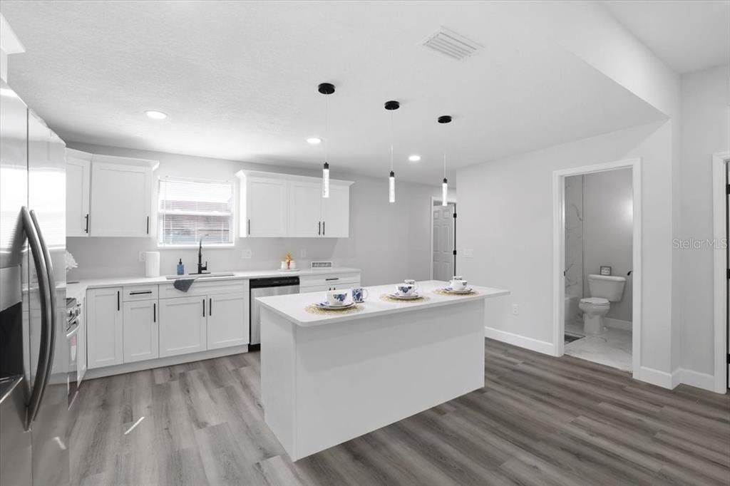 Interior, Kitchen, Pendant Lights, Recessed Lighting, Stainless Steel Appliances, Wood Texture Flooring