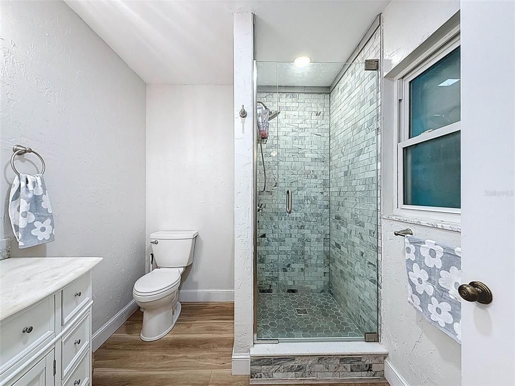 Bathroom, Glass Shower, Interior, Recessed Lighting, Wood Texture Flooring