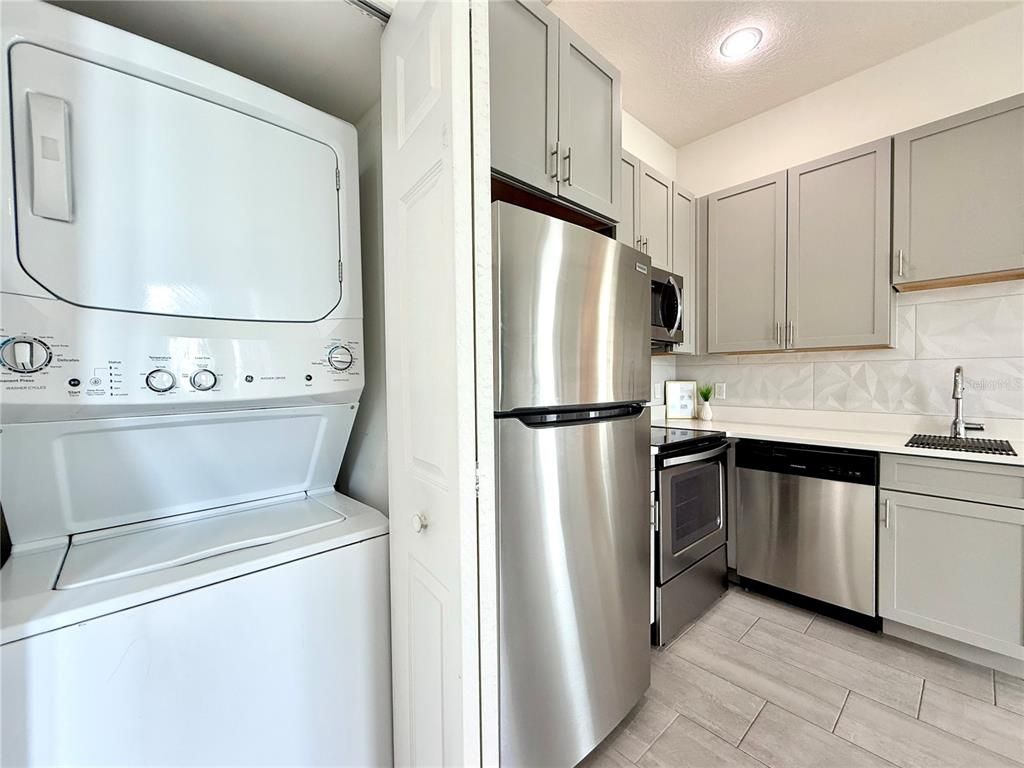 Interior, Kitchen, Recessed Lighting, Stainless Steel Appliances, Washer, Wood Texture Flooring
