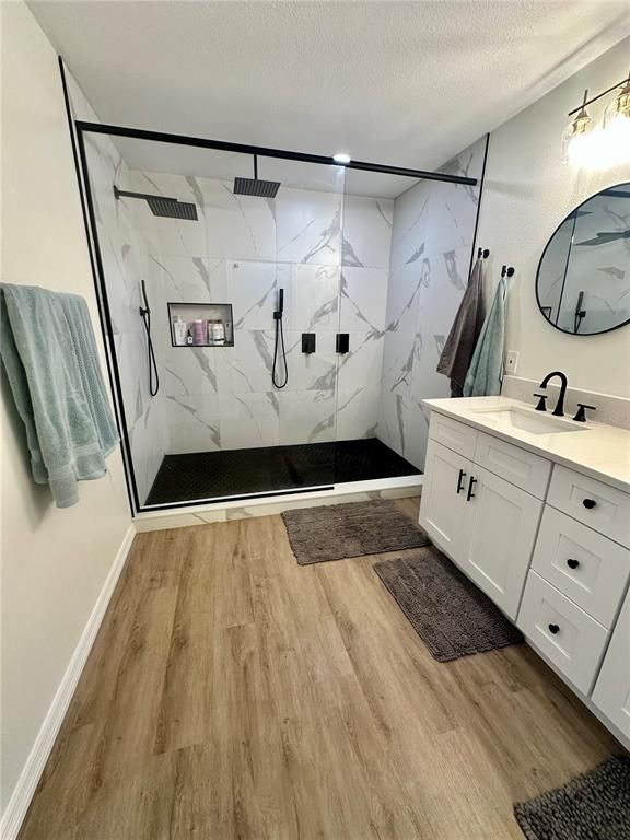 Bathroom, Glass Shower, Interior, Marble Walls, Wood Texture Flooring