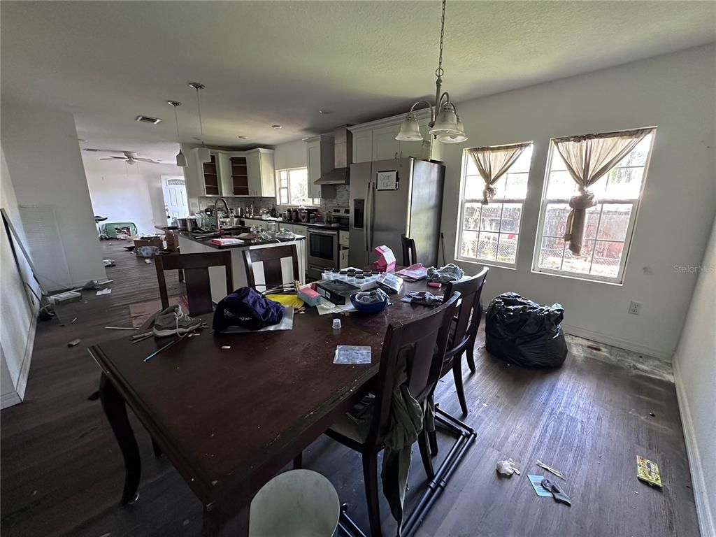 Dining room, Interior, Kitchen, Pendant Lights, Recessed Lighting, Stainless Steel Appliances, Wood Texture Flooring