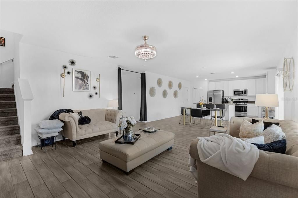 Chandelier, Dining room, Interior, Kitchen, Living room, Recessed Lighting, Stainless Steel Appliances, Wood Texture Flooring