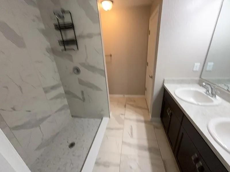 Bathroom, Dual Sink Vanities, Glass Shower, Interior, Marble, Marble Walls