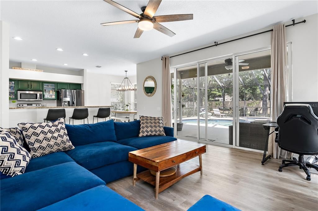 Chandelier, Dining room, Interior, Kitchen, Living room, Pendant Lights, Recessed Lighting, Stainless Steel Appliances, Wood Texture Flooring