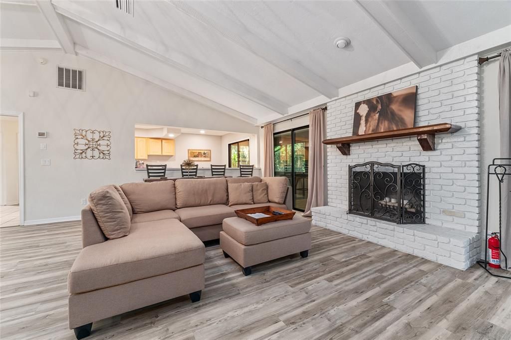 Fireplace, Interior, Kitchen, Living room, Recessed Lighting, Stone Walls, Wood Texture Flooring