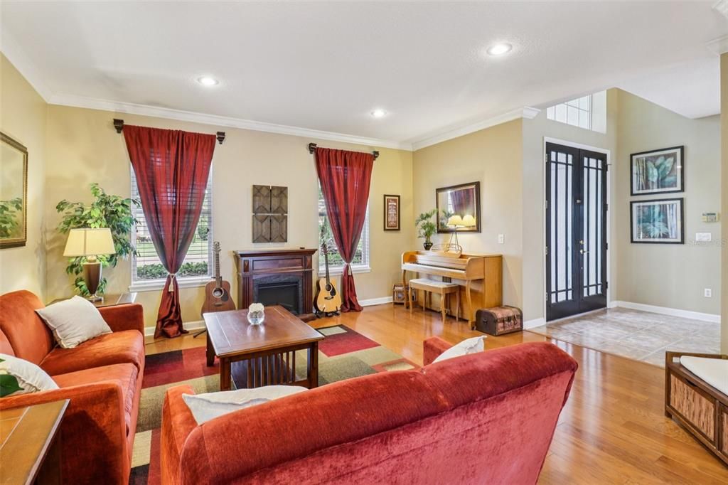 Fireplace, Interior, Living room, Piano, Recessed Lighting, Wood Texture Flooring