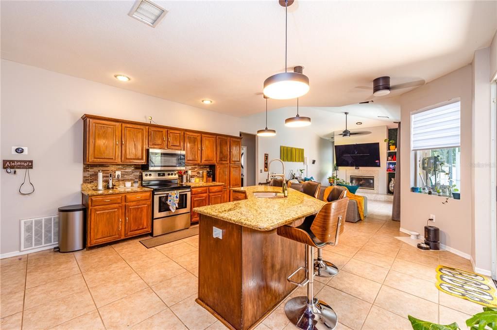 Fireplace, Interior, Kitchen, Pendant Lights, Recessed Lighting, Stainless Steel Appliances