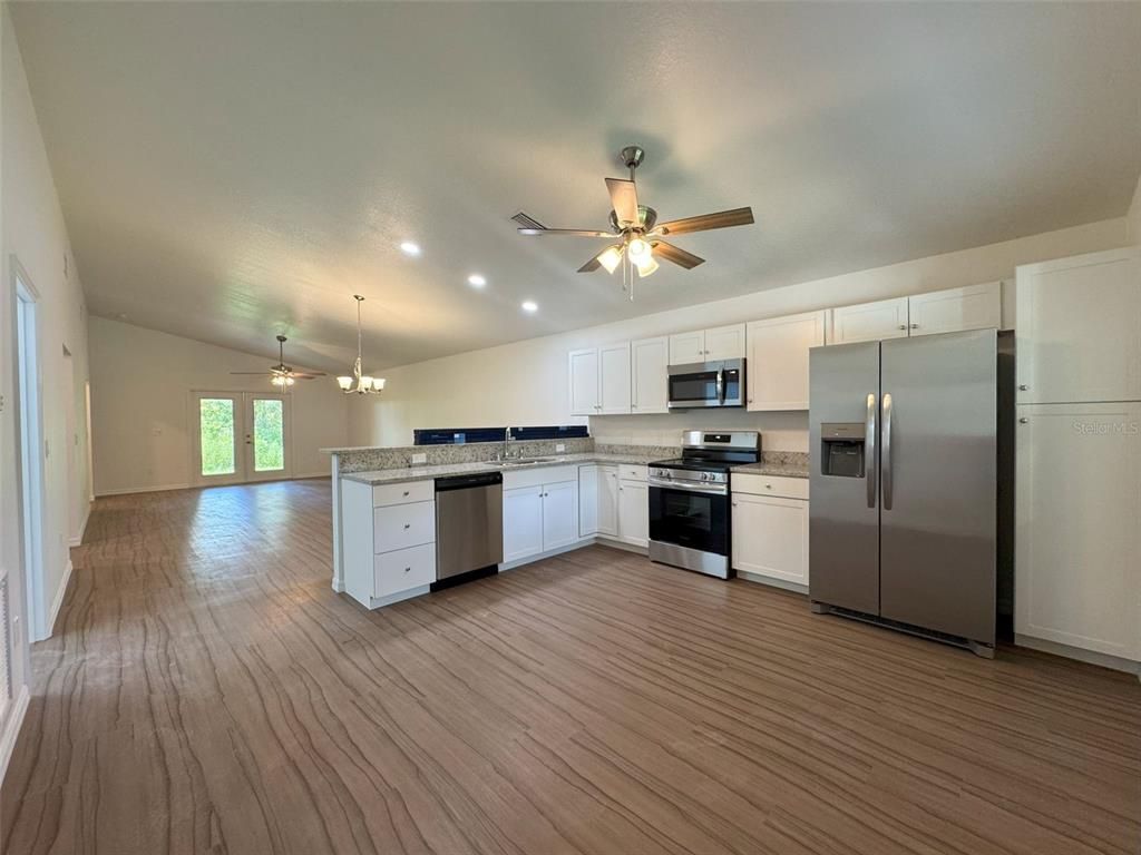 Interior, Kitchen, Pendant Lights, Recessed Lighting, Stainless Steel Appliances, Wood Texture Flooring