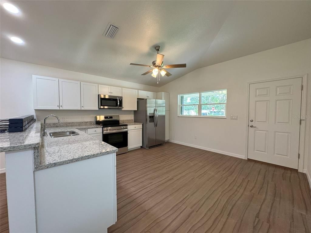 Interior, Kitchen, Recessed Lighting, Stainless Steel Appliances, Wood Texture Flooring
