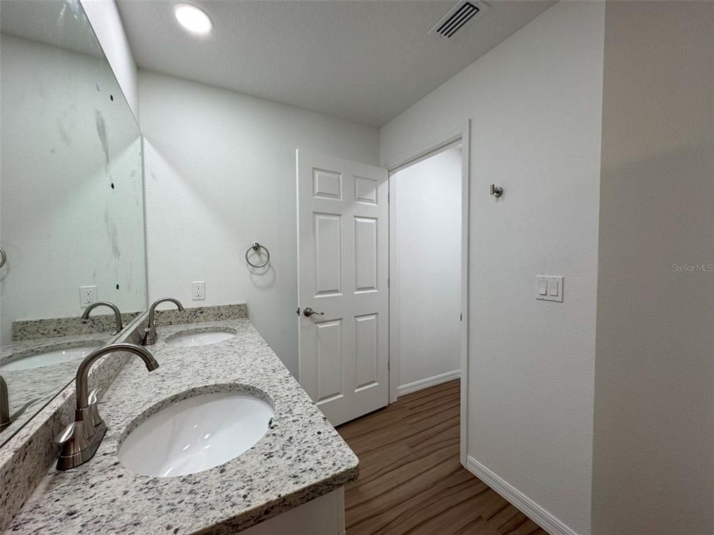 Bathroom, Dual Sink Vanities, Interior, Recessed Lighting, Wood Texture Flooring