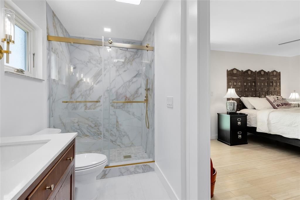 Bathroom, Bedroom, Glass Shower, Interior, Marble, Marble Walls, Recessed Lighting, Wood Texture Flooring