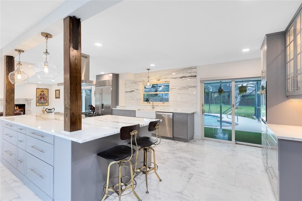 Fireplace, Interior, Kitchen, Marble, Marble Walls, Pendant Lights, Recessed Lighting, Stainless Steel Appliances
