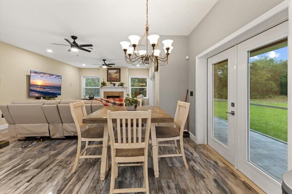 Chandelier, Dining room, Fireplace, Interior, Recessed Lighting, Wood Texture Flooring