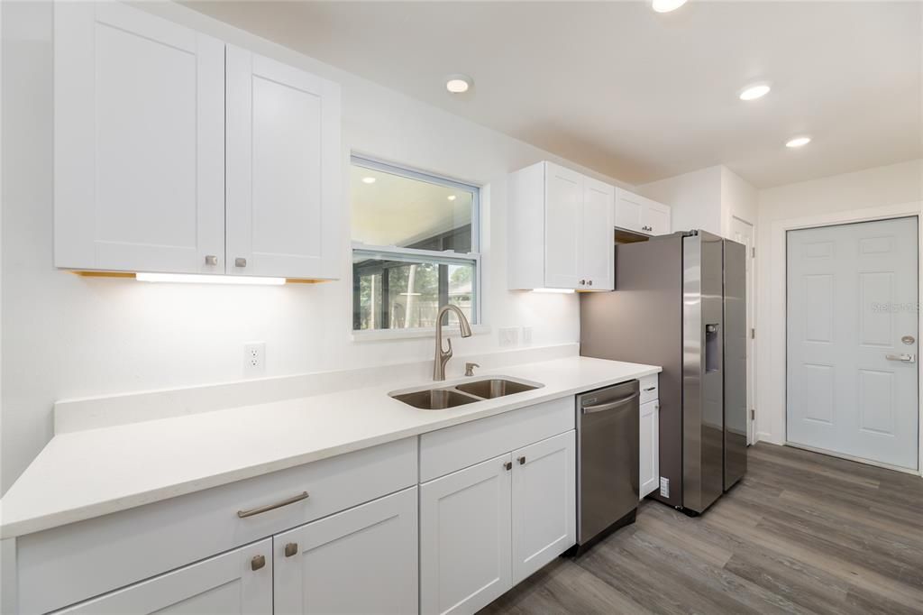 Interior, Kitchen, Recessed Lighting, Stainless Steel Appliances, Wood Texture Flooring