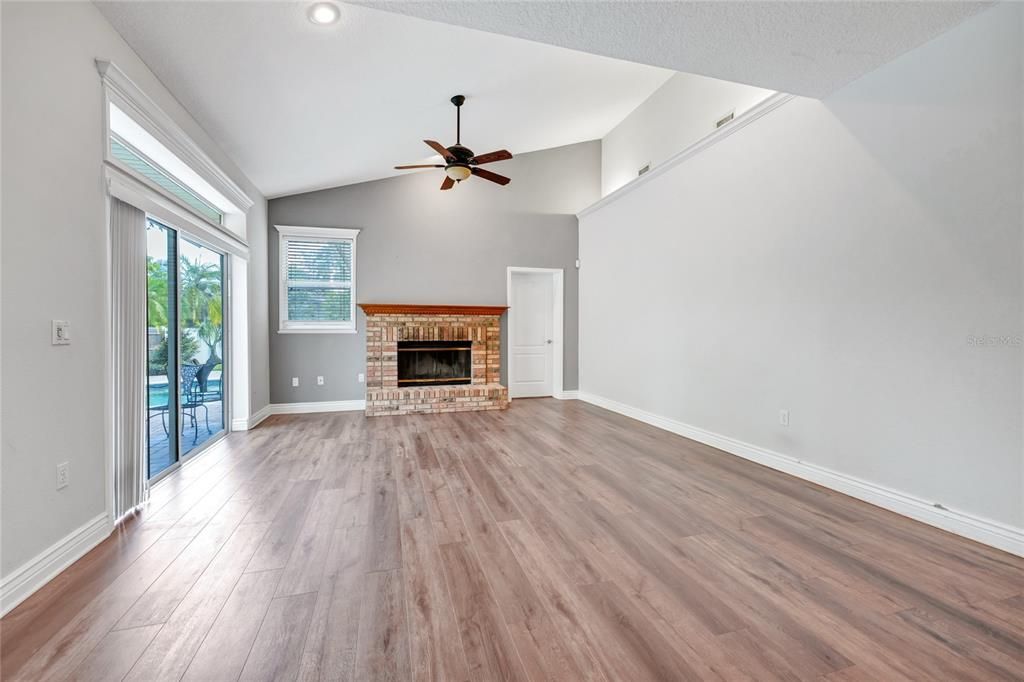 Empty room, Fireplace, Interior, Recessed Lighting, Wood Texture Flooring