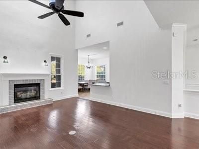 Chandelier, Dining room, Empty room, Fireplace, Interior, Recessed Lighting, Wood Texture Flooring