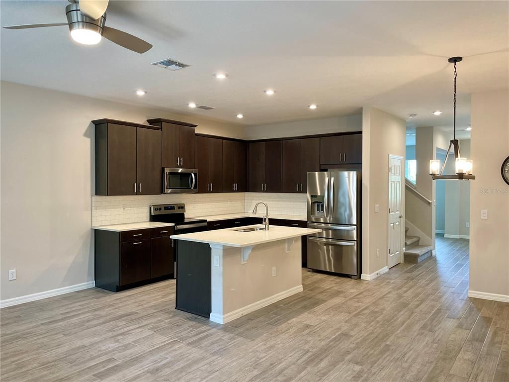 Interior, Kitchen, Pendant Lights, Recessed Lighting, Stainless Steel Appliances, Wood Texture Flooring