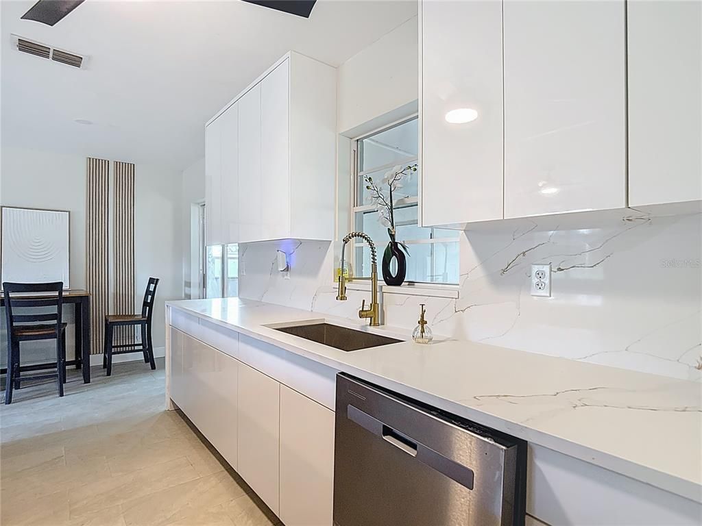 Dining room, Interior, Kitchen, Marble Walls, Recessed Lighting, Stainless Steel Appliances, Wood Texture Flooring