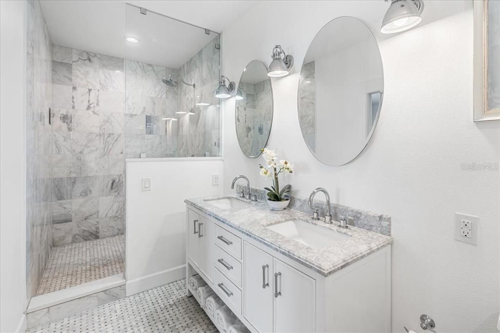 Bathroom, Dual Sink Vanities, Glass Shower, Interior, Marble Walls, Recessed Lighting