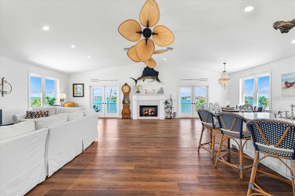 Chandelier, Dining room, Fireplace, Interior, Living room, Recessed Lighting, Wood Texture Flooring
