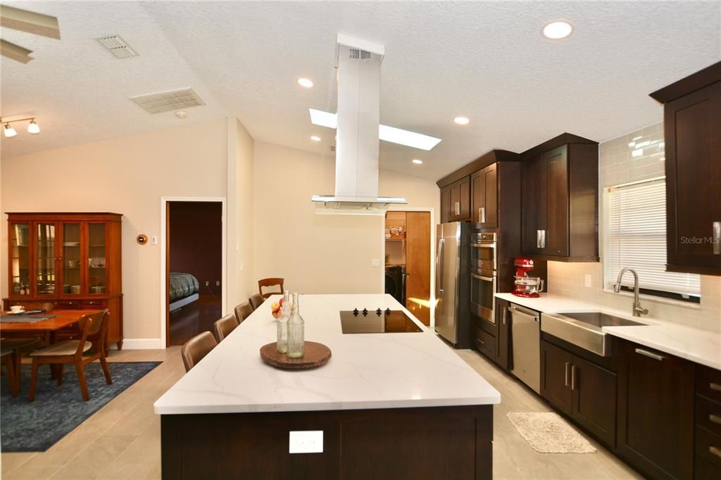 Dining room, Interior, Kitchen, Recessed Lighting, Stainless Steel Appliances, Wood Texture Flooring