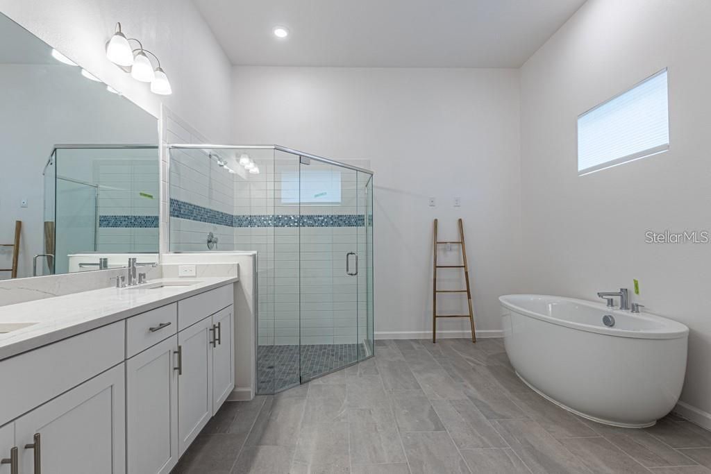 Bathroom, Dual Sink Vanities, Free Standing Baths, Glass Shower, Interior, Recessed Lighting, Wood Texture Flooring